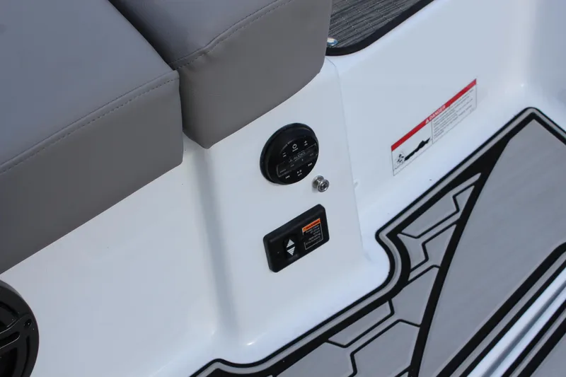 Slide: The Image of 2025 Four Winns HD3 boat interior with gray seating and control panel. - 6
