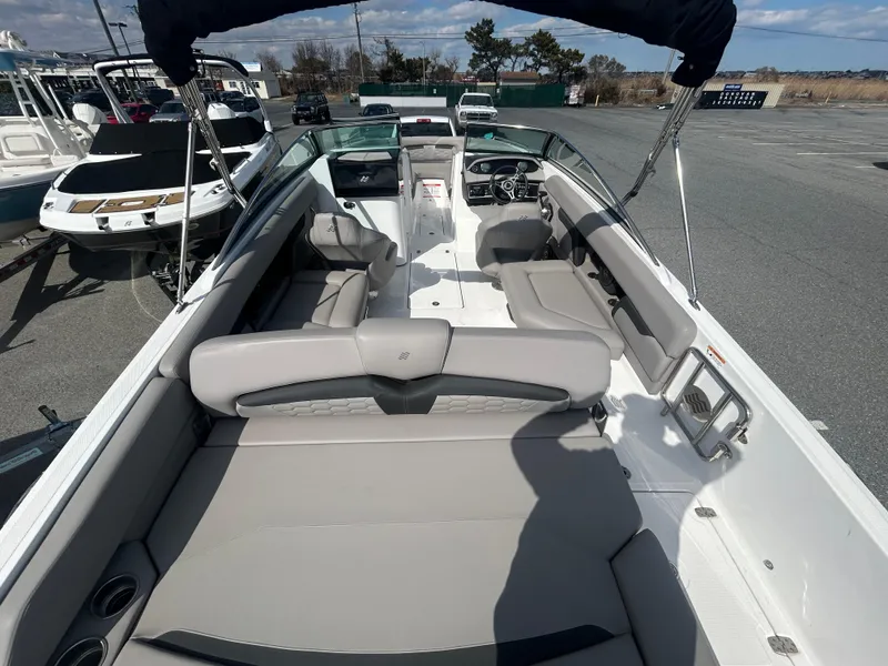 Slide: The Image of 2024 Four Winns HD5 OB boat interior with spacious seating and modern design. - 13