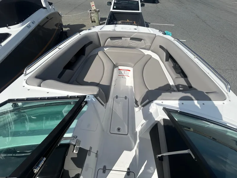 Slide: The Image of 2024 Four Winns HD5 OB boat interior with spacious seating and modern design. - 14