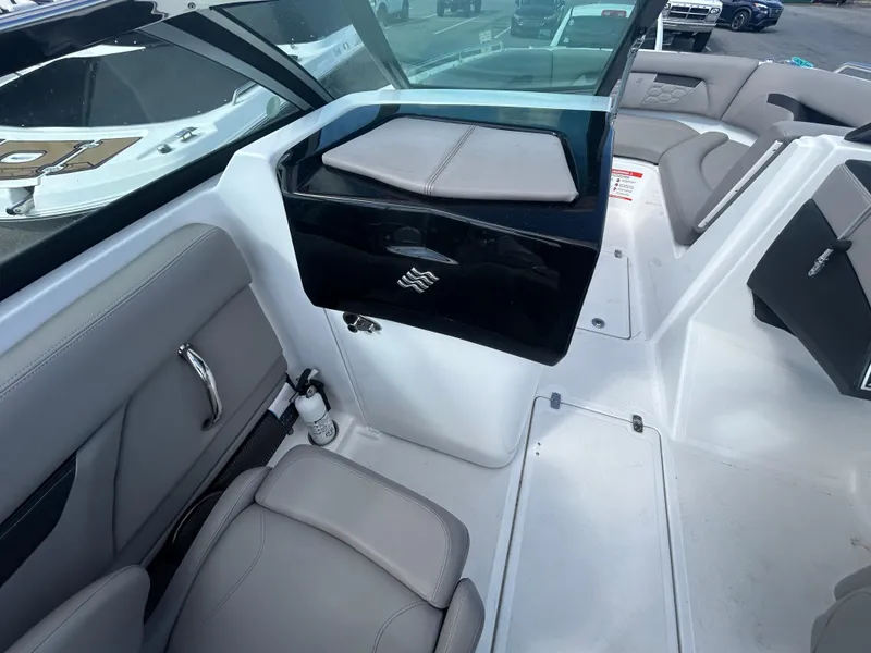 Slide: The Image of 2024 Four Winns HD5 OB boat interior with sleek seating and modern design. - 8