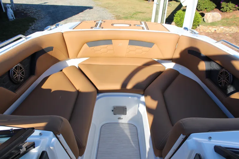 Slide: The Image of 2025 Four Winns HD3 boat interior with tan seating and modern design. - 11
