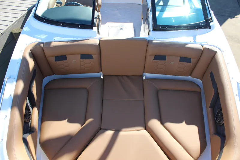 Slide: The Image of 2025 Four Winns HD3 boat with spacious tan seating area. - 12