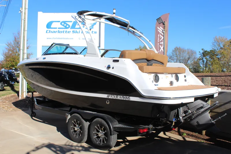 Slide: The Image of 2025 Four Winns HD3 boat on trailer at dealership. - 3