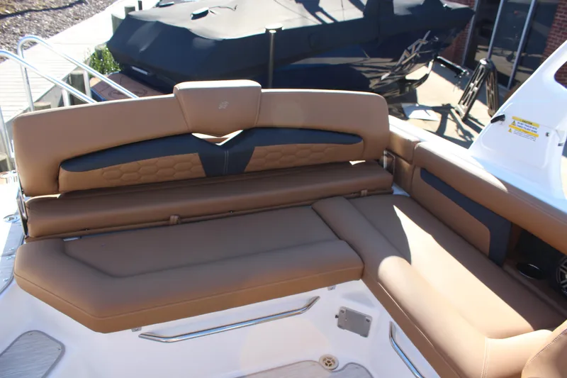 Slide: The Image of Luxurious seating on 2025 Four Winns HD3 boat, featuring tan upholstery and modern design. - 7