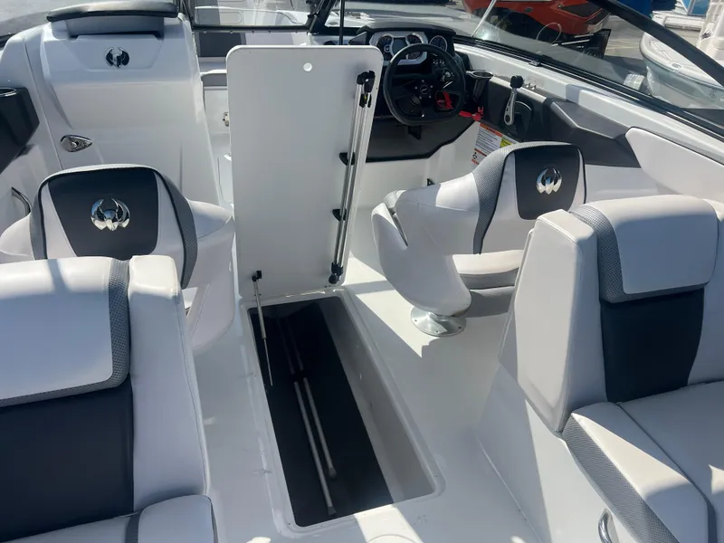 Slide: The Image of 2024 Scarab 255 ID boat interior with modern seating and steering console. - 10