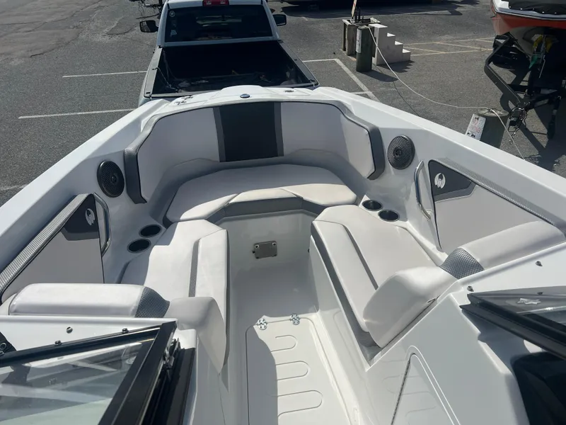 Slide: The Image of 2024 Scarab 255 ID boat interior with white seating and modern design. - 11