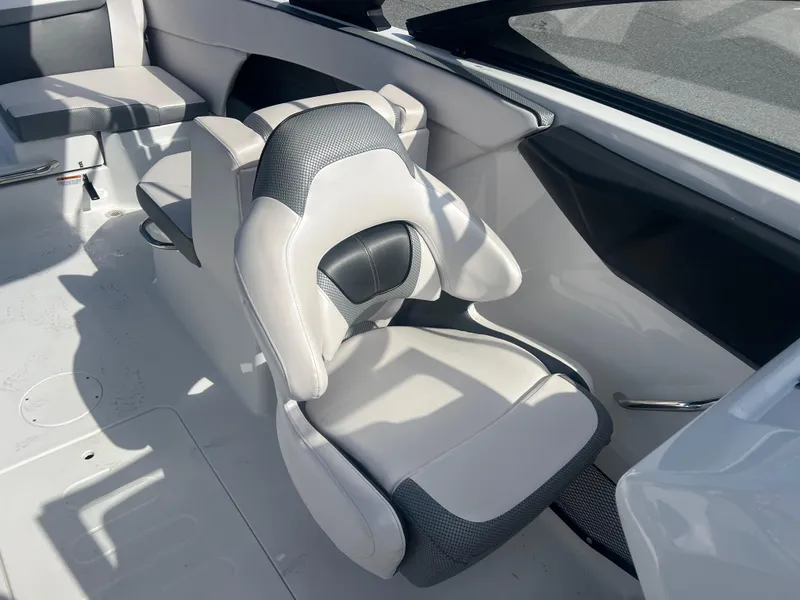 Slide: The Image of 2024 Scarab 255 ID boat interior with modern seating design and sleek upholstery. - 15