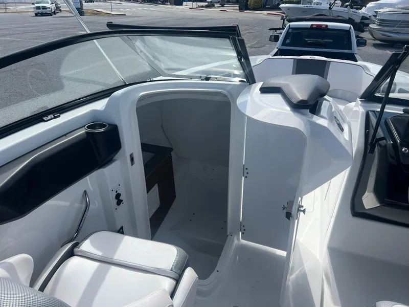 Slide: The Image of 2024 Scarab 255 ID boat interior with seating and storage area. - 16