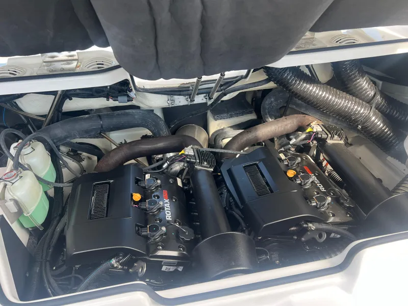 Slide: The Image of 2024 Scarab 255 ID engine compartment with dual Rotax engines, showcasing advanced marine technology. - 26