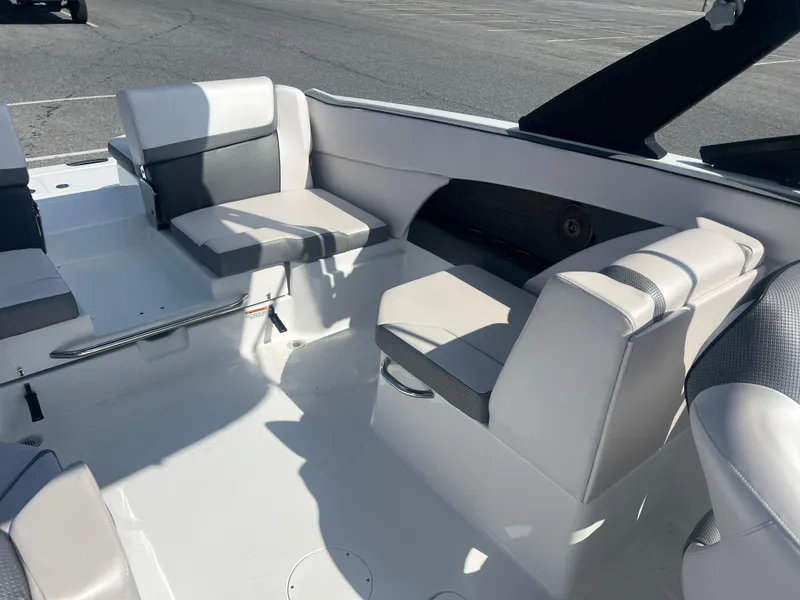 Slide: The Image of 2024 Scarab 255 ID boat interior with white and gray seating arrangement. - 7