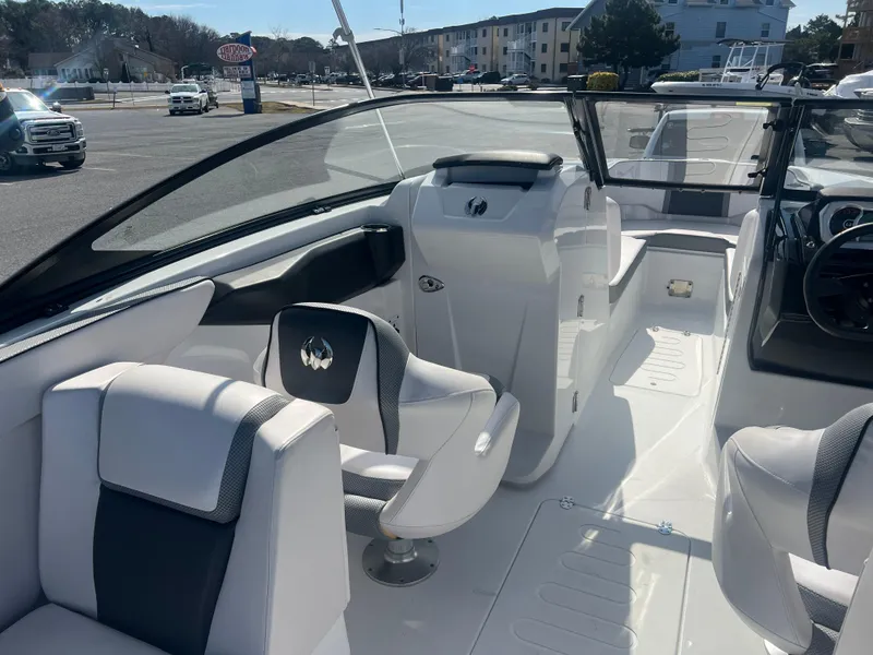 Slide: The Image of 2024 Scarab 255 ID boat interior with sleek seating and modern dashboard design. - 8