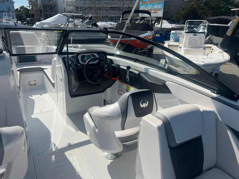 Slide: The Image of 2024 Scarab 255 ID boat interior with sleek design and modern dashboard. - 9
