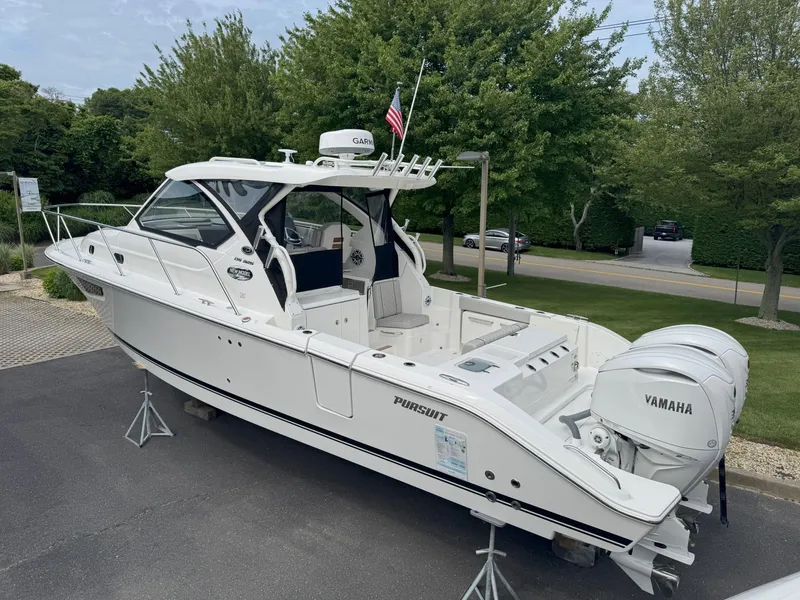 The Image of 2025 Pursuit OS 325 Offshore boat with Yamaha engines, displayed outdoors. - 0
