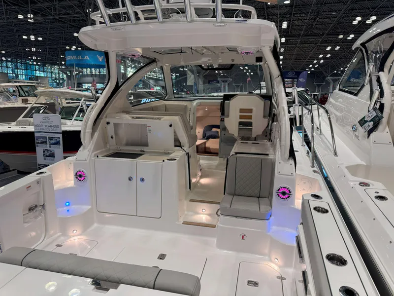 Slide: The Image of 2025 Pursuit OS 325 Offshore boat interior at a boat show, featuring modern design and amenities. - 10