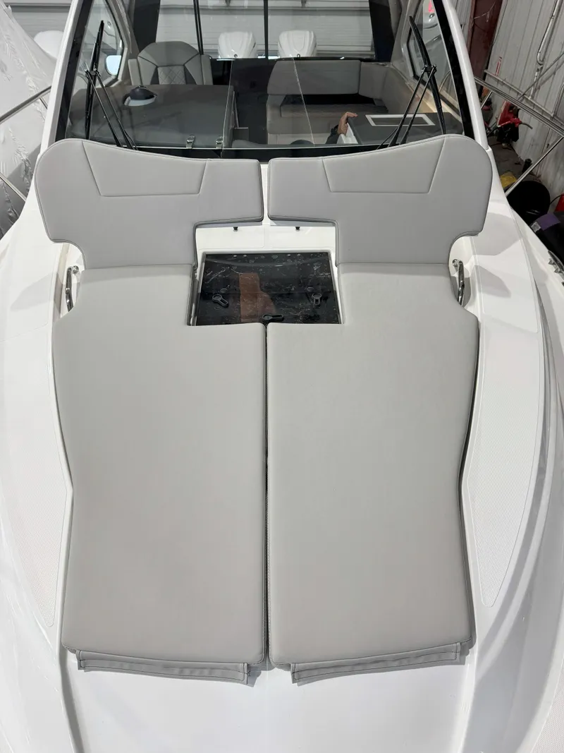 Slide: The Image of 2025 Pursuit OS 325 Offshore boat with cushioned deck seating. - 29