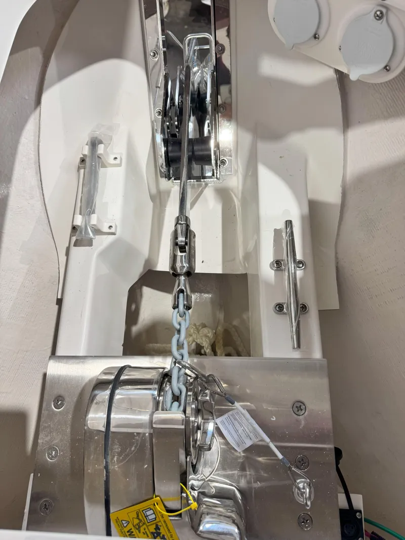 Slide: The Image of Anchor system of 2025 Pursuit OS 325 Offshore boat, featuring stainless steel components. - 30