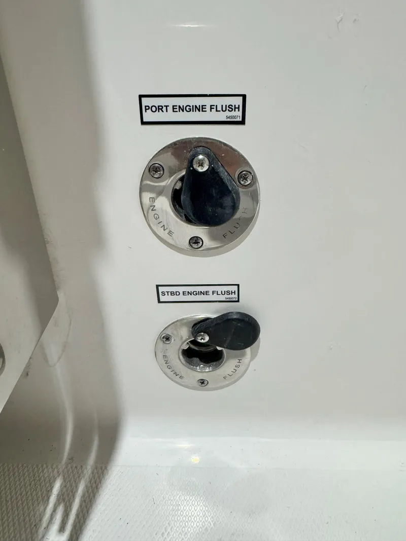 Slide: The Image of 2025 Pursuit OS 325 Offshore engine flush controls for port and starboard engines. - 6