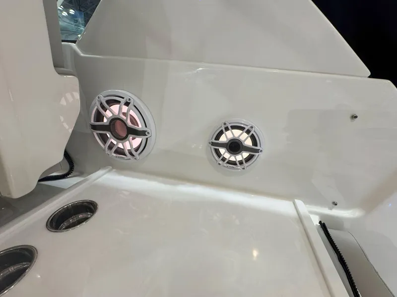 Slide: The Image of 2025 Pursuit OS 325 Offshore boat speakers and cup holders on deck. - 7