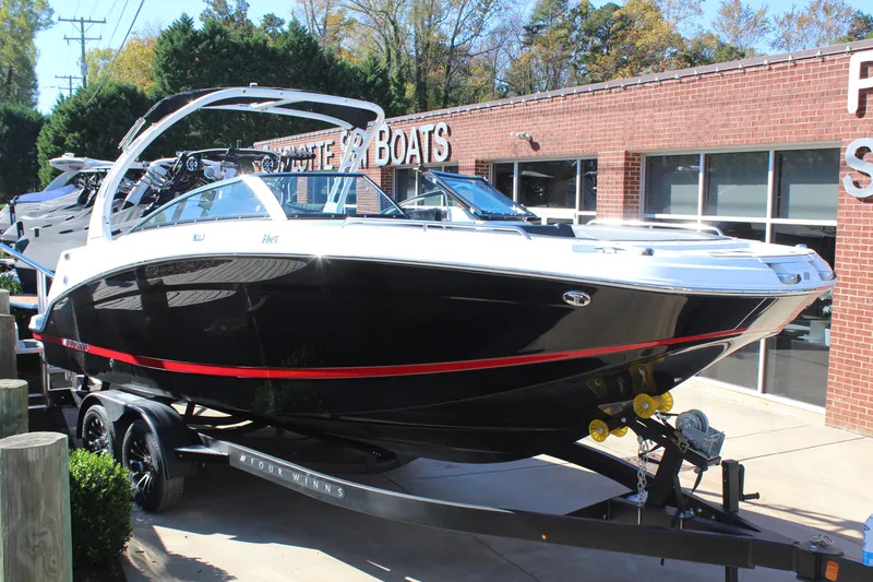 The Image of 2025 Four Winns HD5 boat on trailer outside dealership. - 1