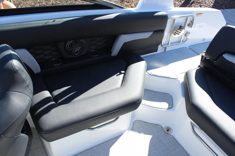 Slide: The Image of Interior seating of 2025 Four Winns HD5 boat with black upholstery. - 9