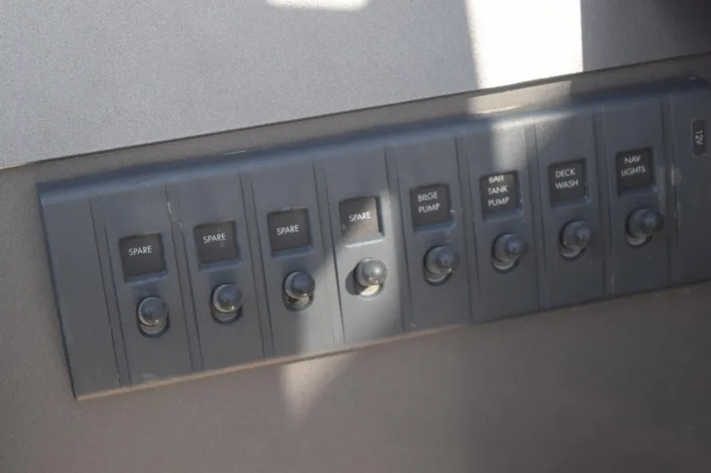 Slide: The Image of Control panel of 2024 Stabicraft 1850 Fisher Sportfish with labeled switches. - 11