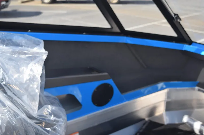 Slide: The Image of 2024 Stabicraft 1850 Fisher Sportfish interior with blue accents and seating. - 22