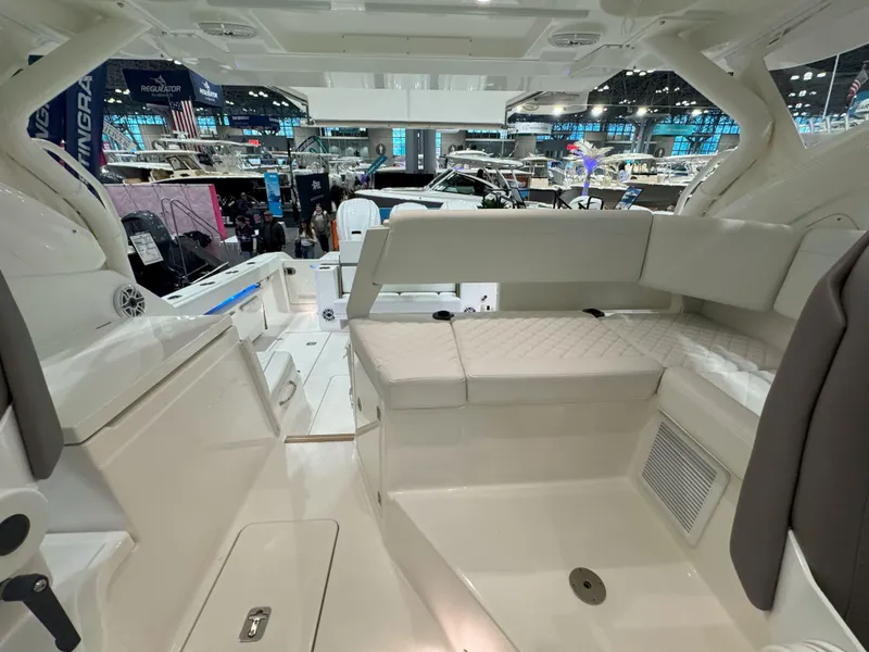Slide: The Image of 2025 Pursuit OS 405 boat interior with modern design and illuminated storage. - 14