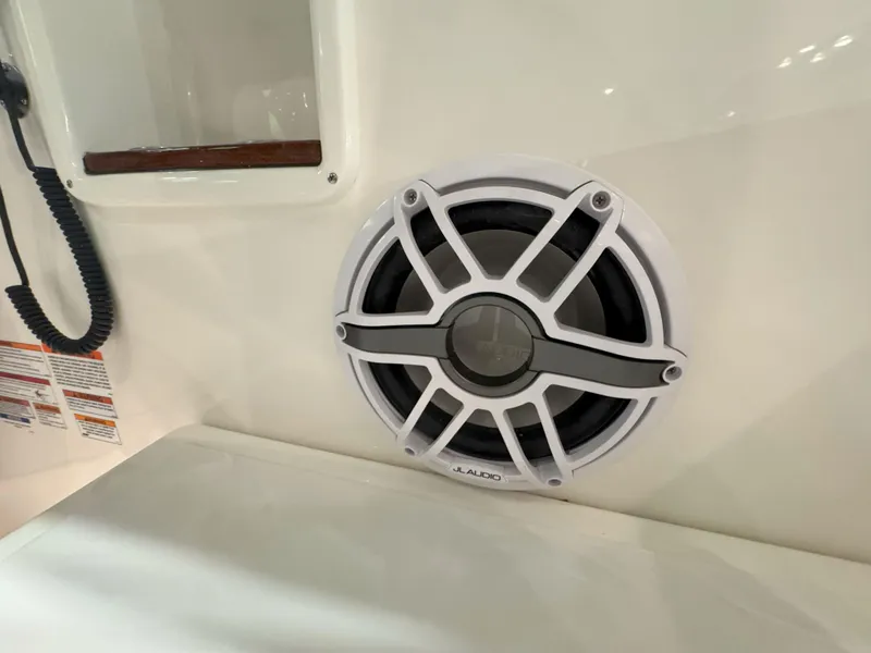 Slide: The Image of 2025 Pursuit OS 405 boat interior with storage compartments and blue LED lighting. - 16