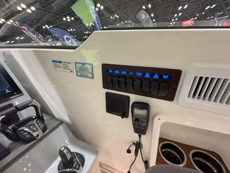 Slide: The Image of 2025 Pursuit OS 405 boat interior with white seating and modern design. - 19