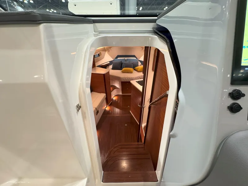Slide: The Image of Interior of 2025 Pursuit OS 405 boat with modern helm and seating. - 21
