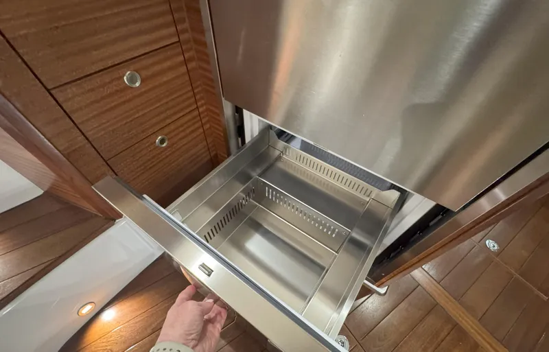 Slide: The Image of Stainless steel drawer in 2025 Pursuit OS 405 boat interior. - 41