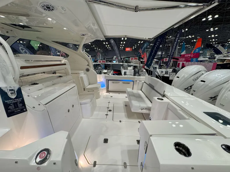 Slide: The Image of 2025 Pursuit OS 405 Offshore boat on calm water, aerial view. - 5