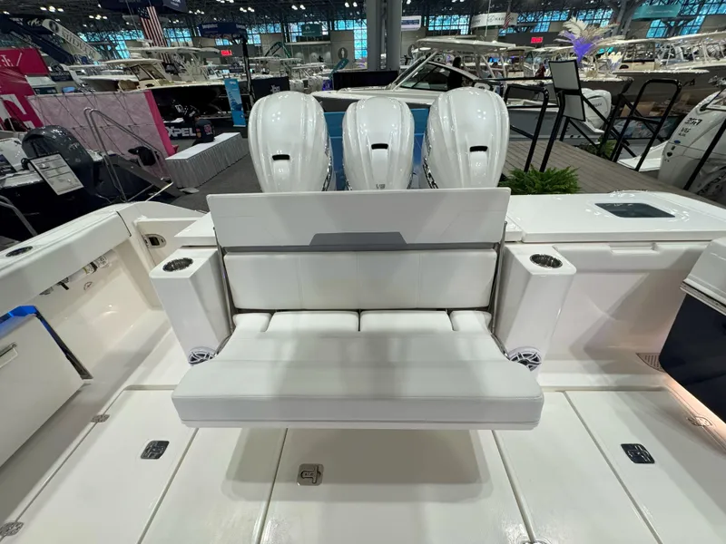 Slide: The Image of 2025 Pursuit OS 405 Offshore boat cruising on calm water. - 7