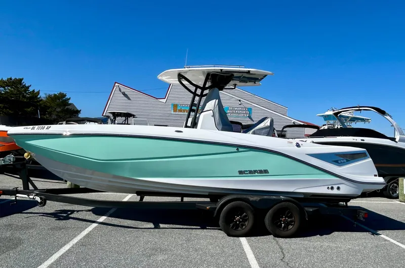 Slide: The Image of 2024 Scarab 255 Open boat with sleek design on a trailer, parked outdoors. - 3