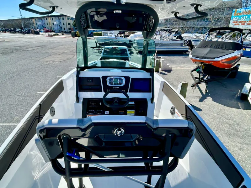 Slide: The Image of 2024 Scarab 255 Open boat interior with steering console and modern dashboard. - 5