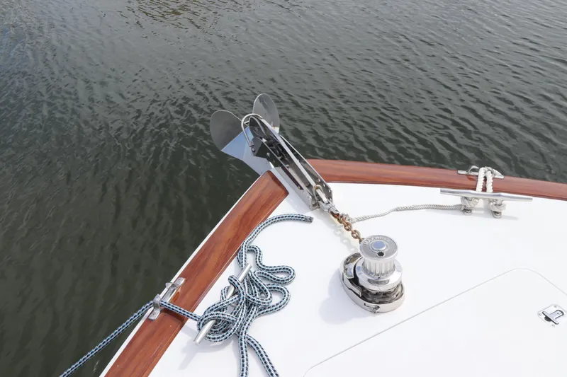 Slide: The Image of Bow of 2000 Viking 65 yacht with anchor and ropes on calm water. - 19