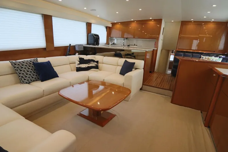 Slide: The Image of Luxurious interior of a 2000 Viking 65 yacht with plush seating and modern kitchen. - 2