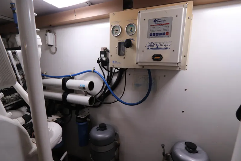Slide: The Image of Engine room of a 2000 Viking 65 yacht with water filtration system. - 25