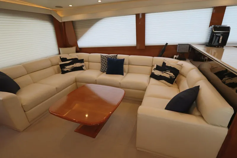 Slide: The Image of Luxurious interior of a 2000 Viking 65 yacht with plush seating and elegant decor. - 4