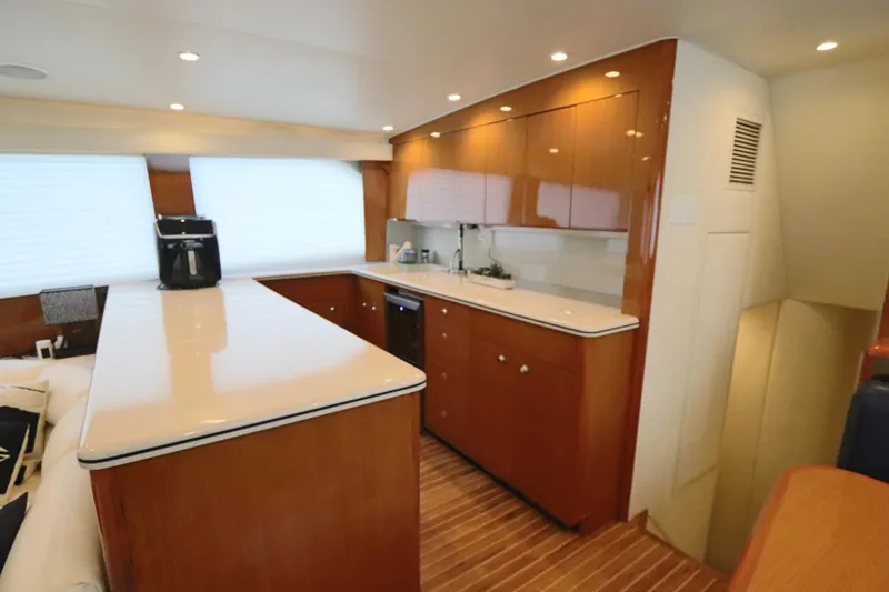 Slide: The Image of Luxurious kitchen interior of a 2000 Viking 65 yacht with modern amenities. - 6