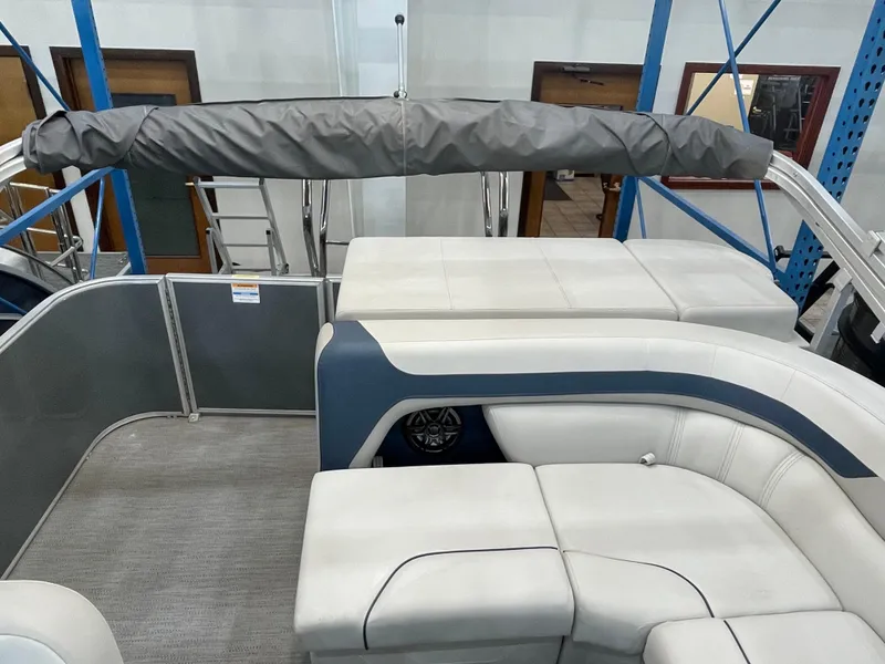 Slide: The Image of 2025 Godfrey Sweetwater 2086 C pontoon boat interior with cushioned seating and covered canopy. - 11