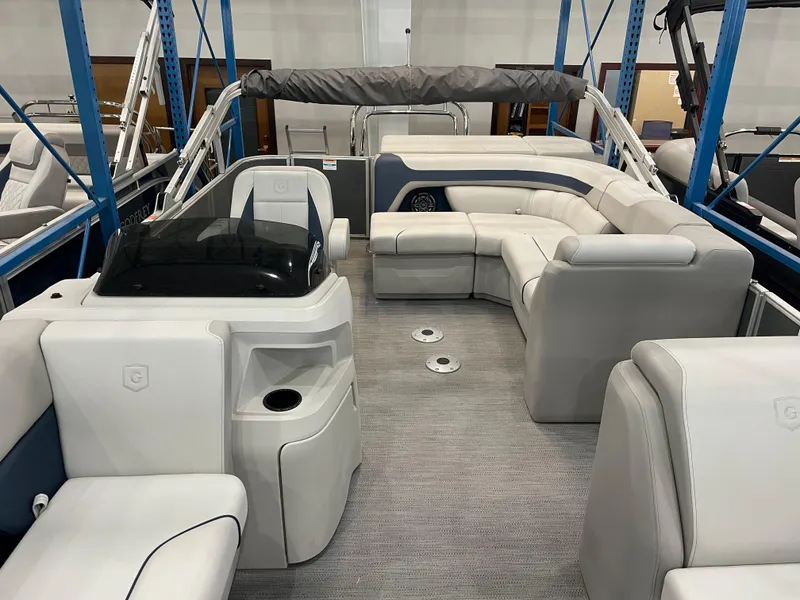 Slide: The Image of 2025 Godfrey Sweetwater 2086 C pontoon boat interior with plush seating and modern design. - 5