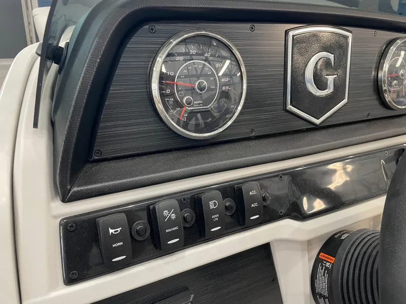 Slide: The Image of Dashboard of 2025 Godfrey Sweetwater 2086 C with gauges and control switches. - 7