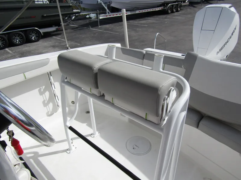Slide: The Image of 2022 Tahoe 2150 CC boat interior with seating and steering wheel. - 18