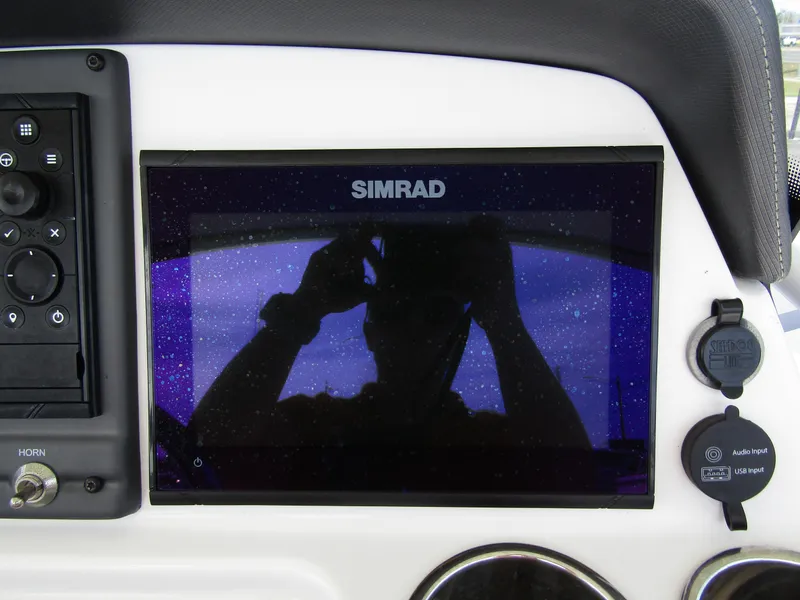 Slide: The Image of Simrad display on 2022 Tahoe 2150 CC boat dashboard. - 22