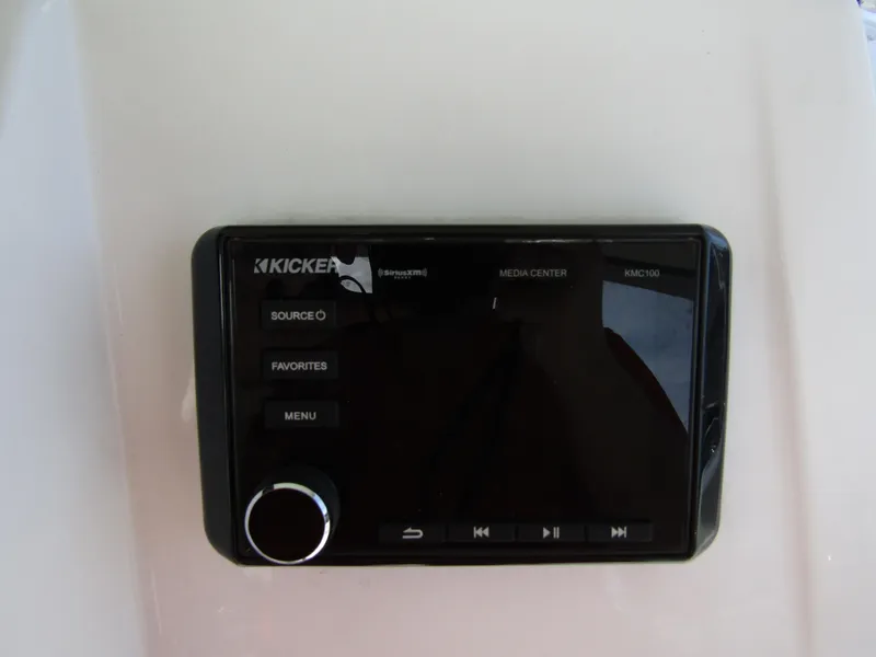 Slide: The Image of Kicker media center on 2022 Tahoe 2150 CC boat dashboard. - 23