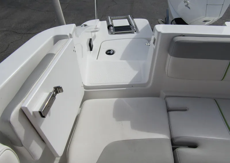 Slide: The Image of 2022 Tahoe 2150 CC boat interior with seating and storage compartment. - 27