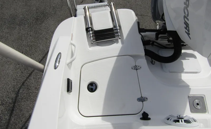 Slide: The Image of 2022 Tahoe 2150 CC boat deck with ladder and engine detail. - 28