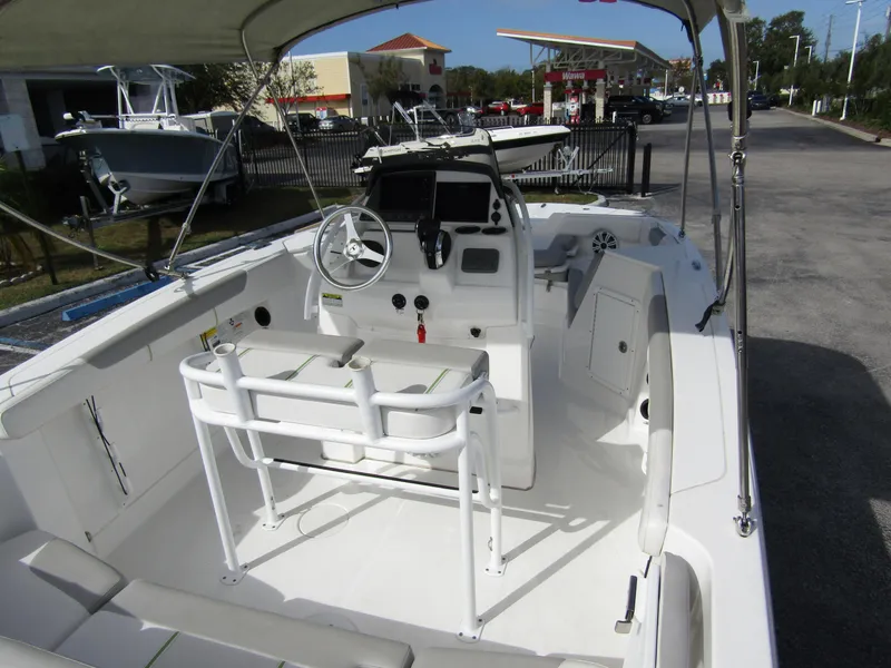 Slide: The Image of 2022 Tahoe 2150 CC boat interior with steering wheel and seating. - 30