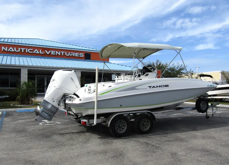 Slide: The Image of 2022 Tahoe 2150 CC boat on trailer at Nautical Ventures dealership. - 4